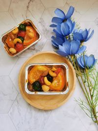 High angle view of fruits in plate on table