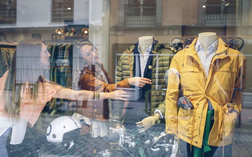 Two women shopping for clothes in a boutique