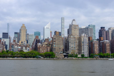 Modern buildings in city against sky