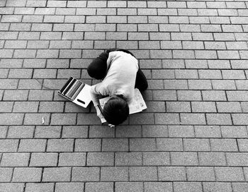 Low section of man using mobile phone