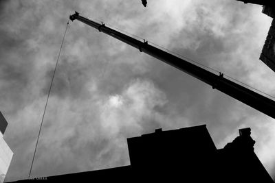Low angle view of building against cloudy sky