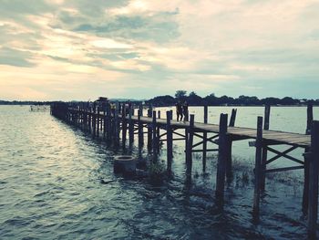 Pier over sea against sky