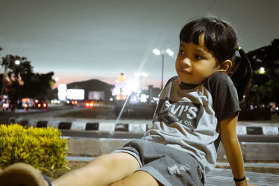 Portrait of boy looking away while sitting in car