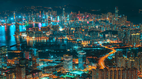 High angle view of illuminated buildings in city at night