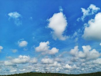 Low angle view of clouds over blue sky