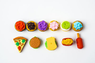 High angle view of candies against white background