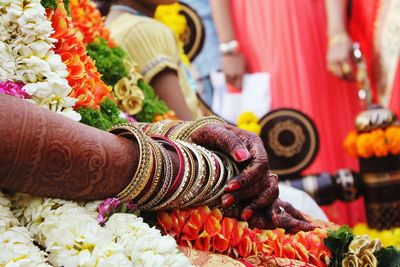 Close-up of bride wearing bangles at wedding