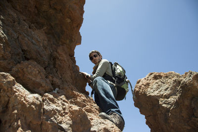 Low angle view of rock formation against clear sky