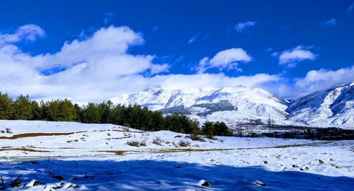 Scenic view of mountains against sky during winter