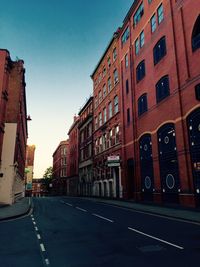 Street amidst buildings against sky