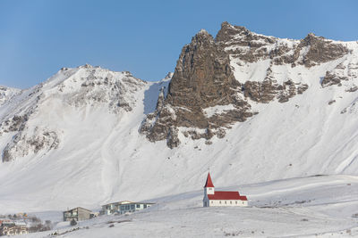 Scenic view of snowcapped mountains against sky