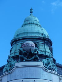 Low angle view of building against blue sky