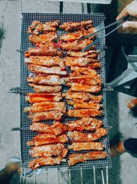 High angle view of meat on barbecue grill