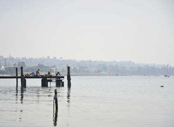 Scenic view of river and city against clear sky