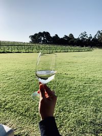 Man holding ice cream cone on land