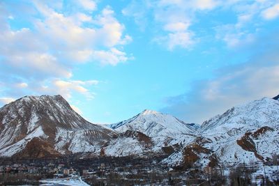 Low angle view of mountains against blue sky