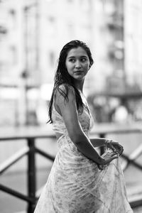 Portrait of woman standing outdoors