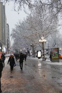 People walking on road in rain