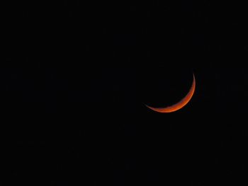 Scenic view of moon against clear sky at night