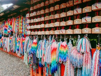 Multi colored flags hanging for sale at market stall