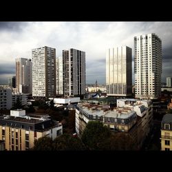 View of city against cloudy sky