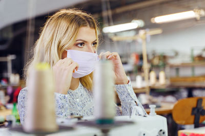 Portrait of a beautiful young woman wearing mask