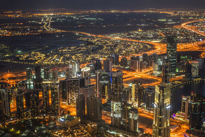 High angle view of illuminated cityscape at night