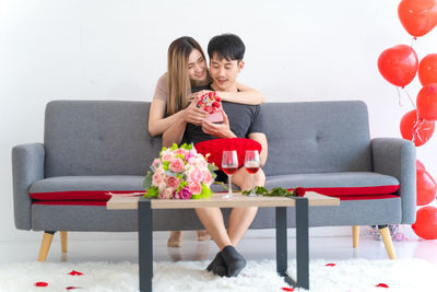 Young couple sitting on sofa