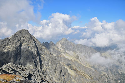 Scenic view of tatra mountains against cloudy sky