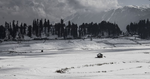 Scenic view of snow covered landscape against sky