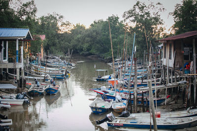 Boats moored at harbor
