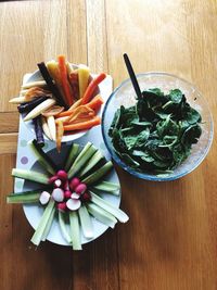 High angle view of chopped vegetables in bowl on table