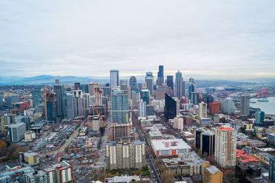 High angle view of city against cloudy sky