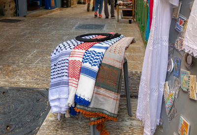 High angle view of clothes hanging at market stall
