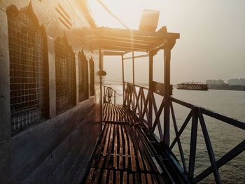 Bridge over sea against buildings in city