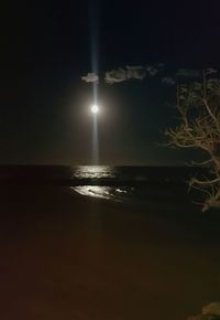 Scenic view of sea against sky at night