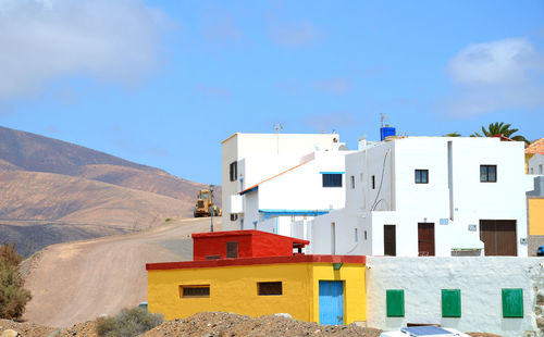View of residential buildings against sky in fuerteventura, spain