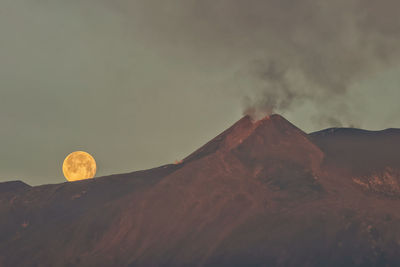 Moon setting over etna