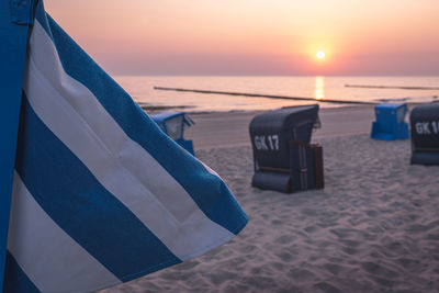 Scenic view of beach against sky during sunset