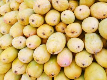 Full frame shot of mangoes at market stall