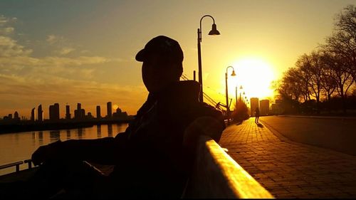 Silhouette of people at sunset