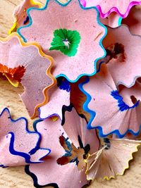 Close-up of colorful pencil shavings on table