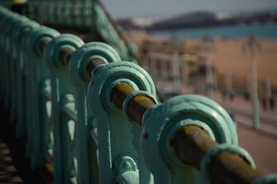 Close-up of railing at brighton pier