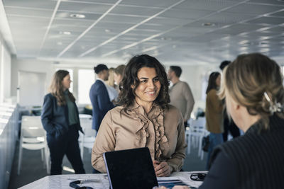 Woman picking up her pass before conference