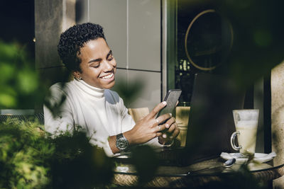 Young woman using smart phone