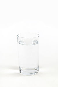 Glass of water against white background