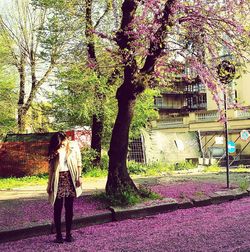 Woman standing on footpath