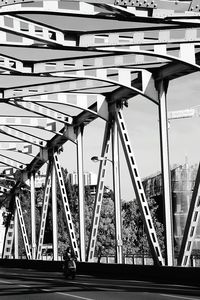 Low angle view of bridge against sky in city