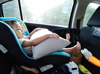 Midsection of man sitting in car