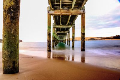 Scenic view of beach against sky during sunset